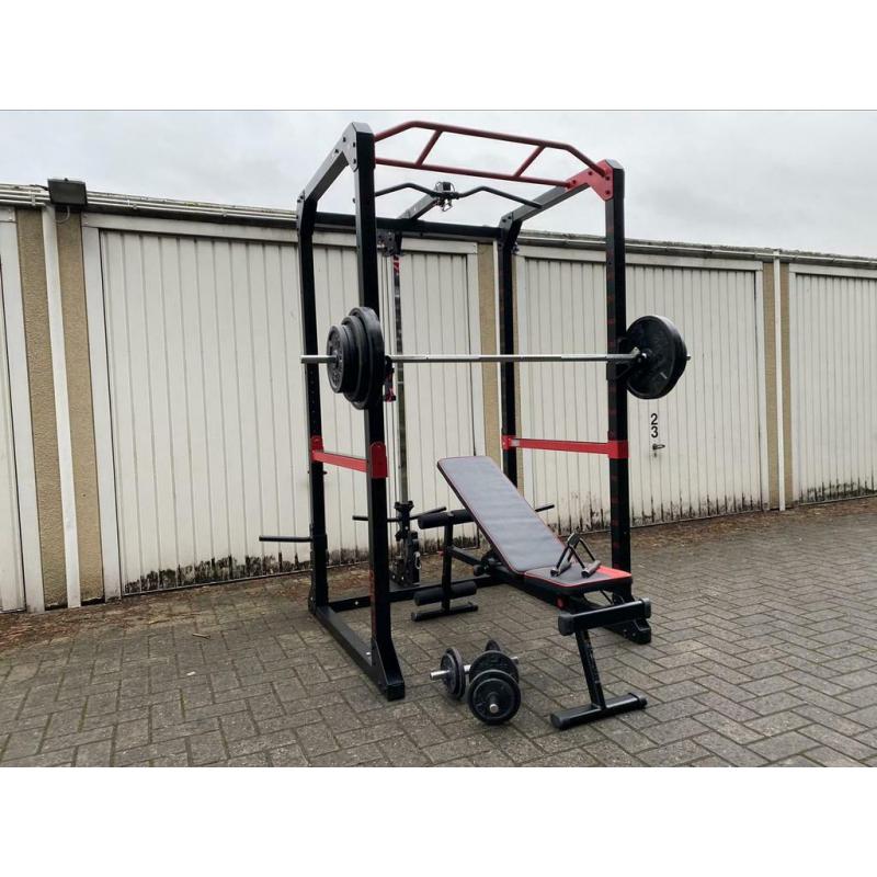 120kg + Powerrack en verstelbaar bankje + dumbells