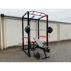 120kg + Powerrack en verstelbaar bankje + dumbells